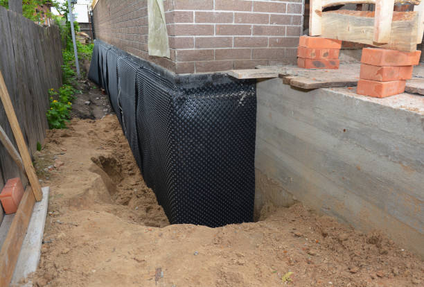 Happy homeowners after waterproofing job in Forest Lake